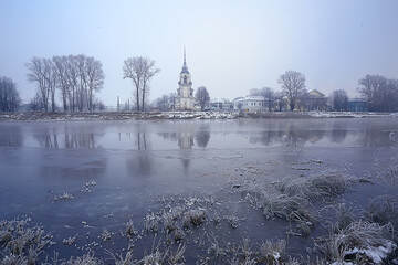 winter landscape church on the banks of the freezing river in vologda, christianity baptism russia...