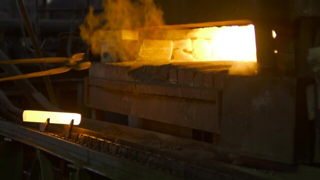 At a steel mill, various parts are smelted from red-hot iron