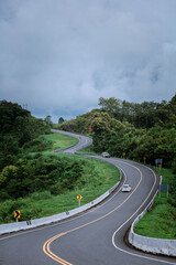 Road no.3 or sky road on Root 1081 over top of mountains with green jungle in Santisuk - Bo Kluea District, Nan province, Thailand.