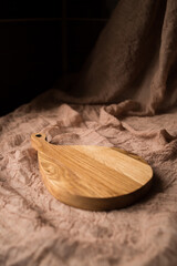 Empty kitchen cutting boards on brown background. Soft fockus