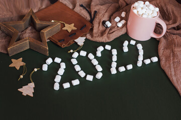 Christmas 2022. Hot chocolate with marshmallows, numbers 2022 from marshmallows. Top view. New Year