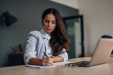 Adult woman, planing for the future of her company.