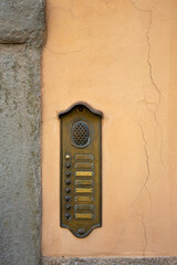 Old brass doorbell in Italy  with blank space