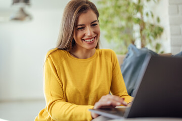 Adult woman, using her new laptop.