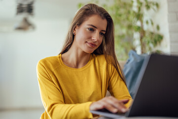 Adult woman, making sure her laptop works.