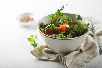 Healthy green salad with smoked salmon