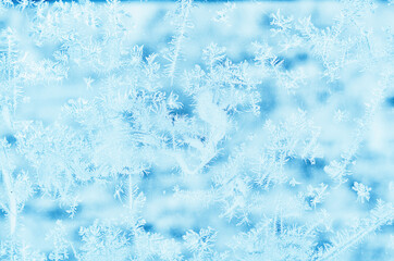 frosty patterns on glass in winter