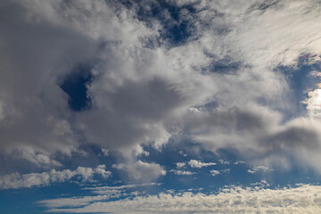 Blue sky with white expressive clouds.