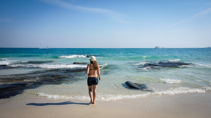 Girl on the sea back view on the island of Samet Thailand