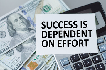 inscription on the card Success is dependent on effort text on the background of money on the table