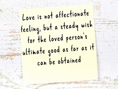 Wise quote on sticky note on wooden wall