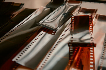 Cut strips of photographic color film. Close-up of color negatives. 