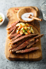 Grilled beef steak with tomato avocado salsa