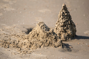 Sand castle and sand pile on the beach