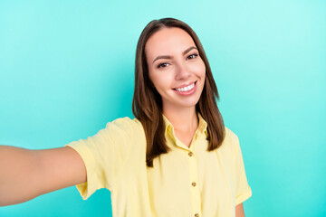 Fototapeta premium Photo of cool millennial brunette lady do selfie wear yellow top isolated on teal color background