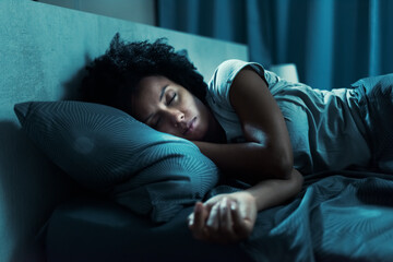 African american woman sleeping in her bed