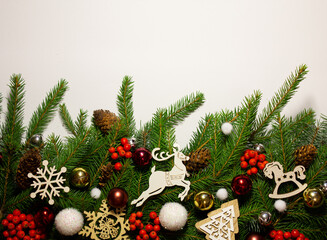 Creative New Year's border from Christmas tree branches. Place for text. New Year and Christmas card. Nature new year concept. Copy space.