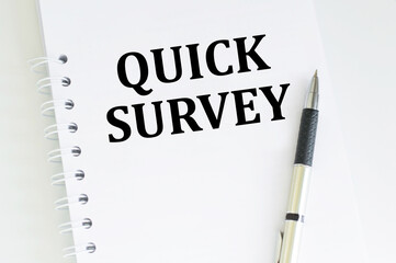 Quick Survey text written on a notebook with pen