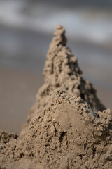 Blurred dark sand tower on the beach