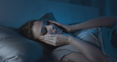 Stressed young woman suffering from insomnia