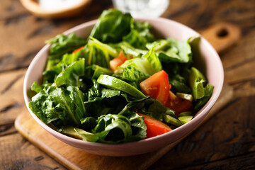 Healthy green salad with tomato and avocado