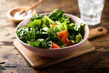 Healthy green salad with tomato and avocado