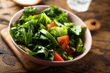 Healthy green salad with tomato and avocado