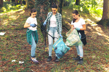 Cleanup volunteers collecting trash in the forest