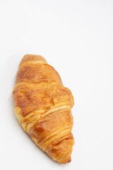 Two fresh juicy croissants with cheese, jam, cream on puff pastry without filling with crumbs on a white background close macro