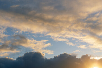 Fototapeta premium A gray autumn sky with thunderclouds and sunshine. Ready for use with «Sky Replacement» feature in the Adobe Photoshop.
