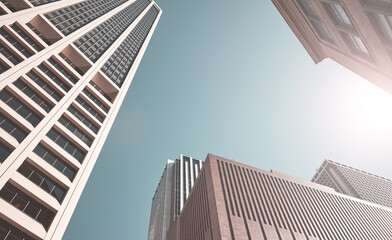 Looking up at New York skyscrapers, color toning applied, USA.