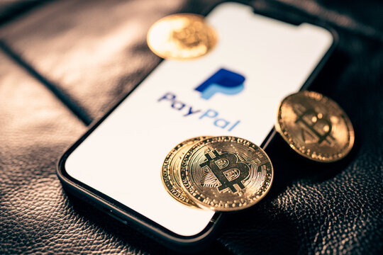 Bangkok, Thailand - Oct 25, 2021 : Closeup - Bitcoin Cryptocurrency coins paypal online payment logo in mobile phone.