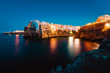 Night view of the village of Polignano a Mare illuminated by the lights