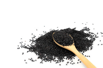 Black sesame on a wooden spoon. isolated on a white background.