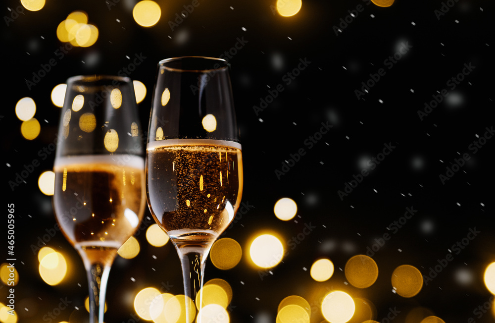 Wall mural two glasses of champagne or sparkling wine . bokeh garland, christmas card background copy space. sn