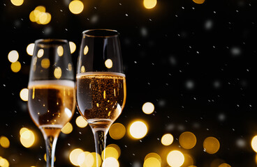 Two glasses of champagne or sparkling wine . Bokeh garland, Christmas card background copy space. snow is falling