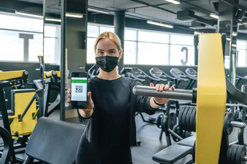 Fitness,sports.fit,Girl in mask fitness gym  opening lockdown covid passport,QR cod Wellness, health care,generation z sports recreation concept online fitness apps. workout,training,Fit wellness