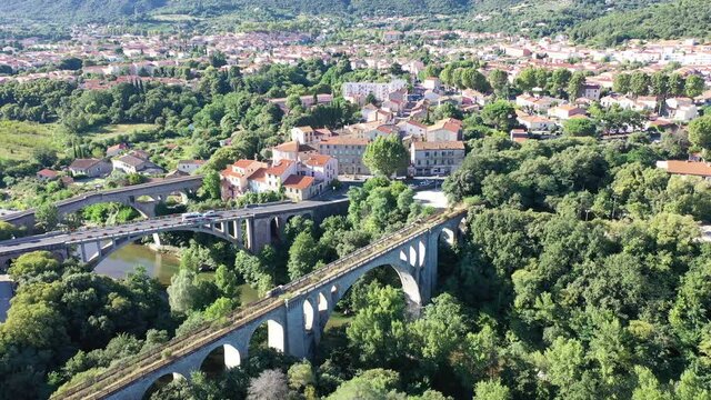 Flight over the city Ceret on summer day. France 