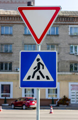 Road traffic sign. Pedestrian crossing sign. Pedestrian crossing in the city.