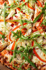 Appetizing close up of thick crust pizza on a wooden table