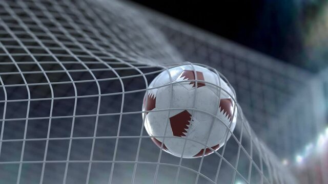 World Cup soccer ball, Qatar. It flies into the grid of the gate, against the background of the lamps. Slow motion. 3D rendering.