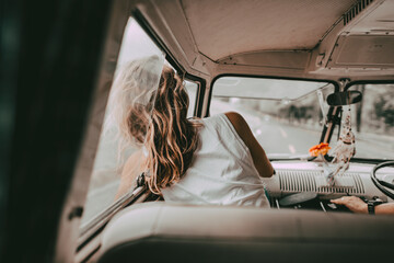 Boho woman road trip portrait in a minivan, travel HD photo