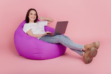 Full size profile side photo of young business woman use laptop show thumb-up choice promo ad isolated over pink color background