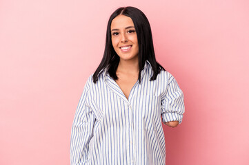 Young caucasian woman with one arm isolated on pink background happy, smiling and cheerful.