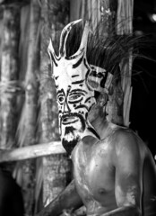 Warrior of the Asmat tribe in a battle mask.