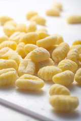 Raw italian gnocchi on a white background