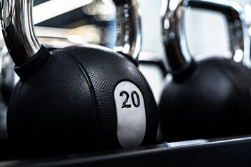 Close up of new dumbbells on a rack in a gym