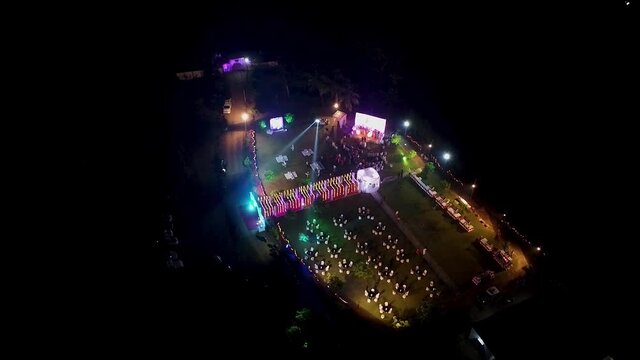 Clip of a function at night. Drone footage of a concert in an open air auditorium