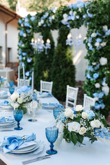 Wedding decor. Elegant table setup in blue pastels.