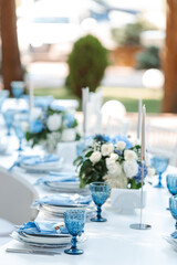 Wedding decor. Elegant table setup in blue pastels.
